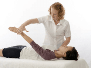 Kinesiology for Anxiety. Kinesiologist treating patient. Brisbane Livewell Clinic.