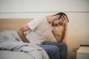 Young man in sleepwear needing chronic fatigue syndrome treatment. Brisbane Livewell Clinic