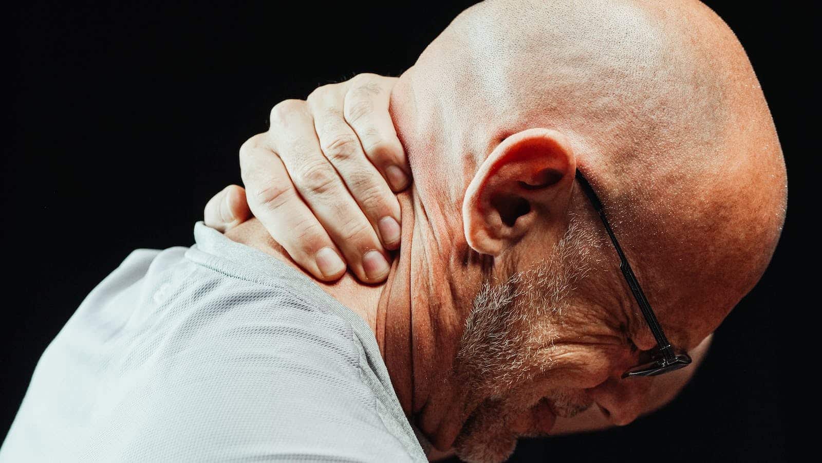Close-Up Photo of a Man Having Neck Pain. Osteoarthritis. Collagen Supplement Australia.