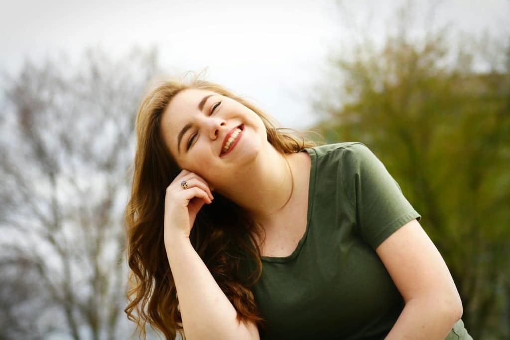 Woman in Green Shirt Smiling. Thyroid Specialist Brisbane