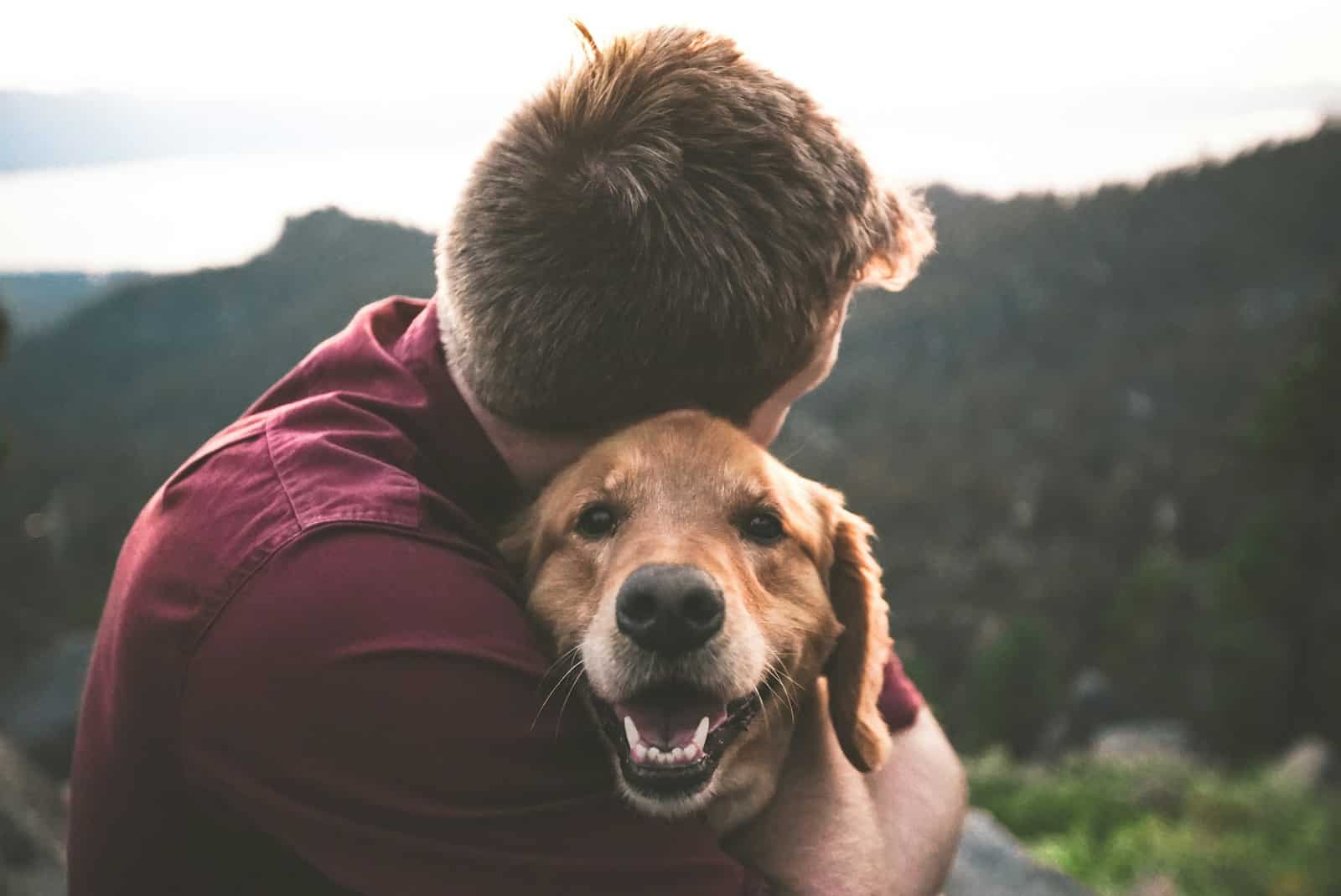 photo of man hugging tan dog. Dietician for Chronic Disease Management